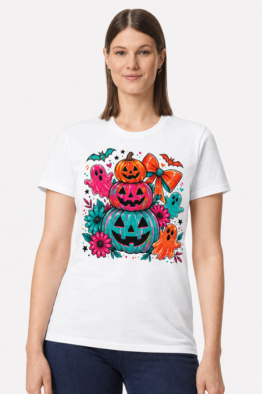 Woman wearing a white t-shirt with a Halloween stacked pumpkins, ghosts and bow print