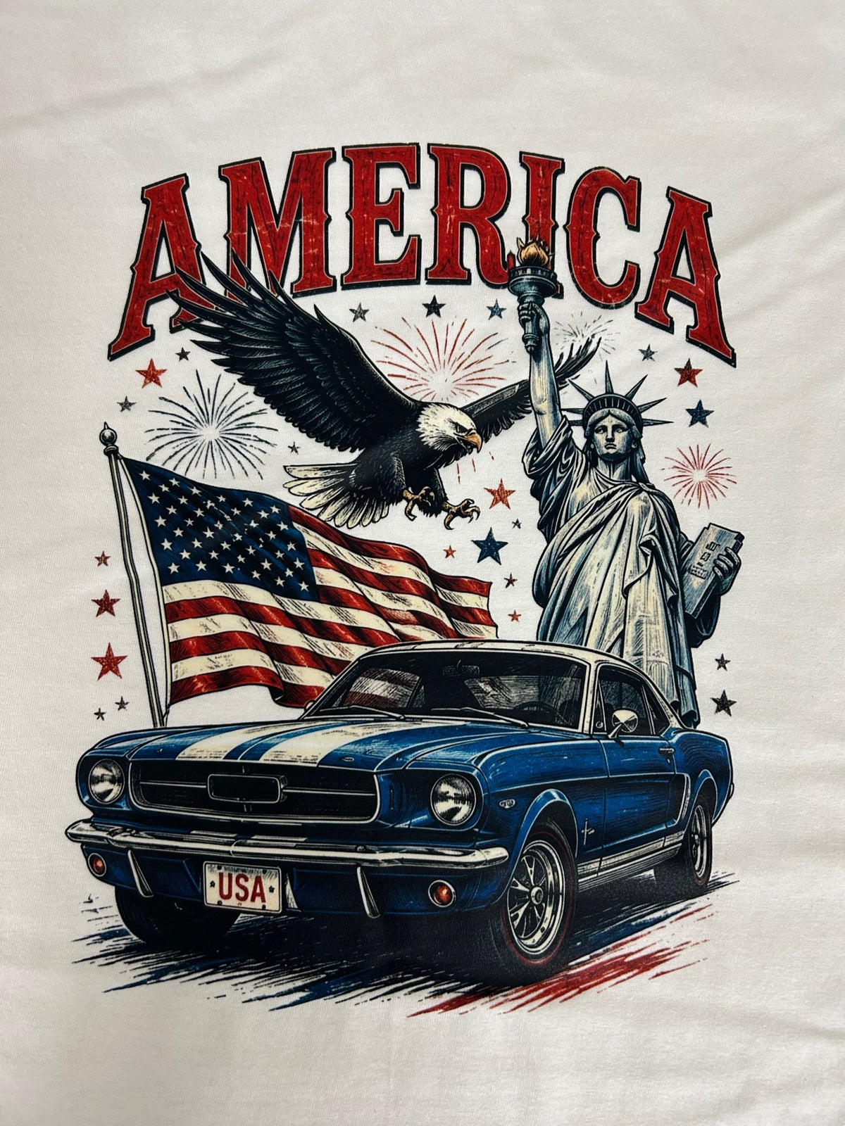 Close-up of the America Ford Mustang print on a white t-shirt