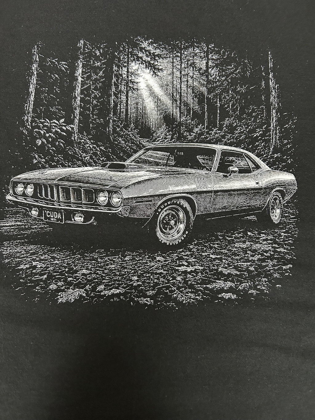 Close-up of the 1971 Plymouth Cuda print on a black t-shirt