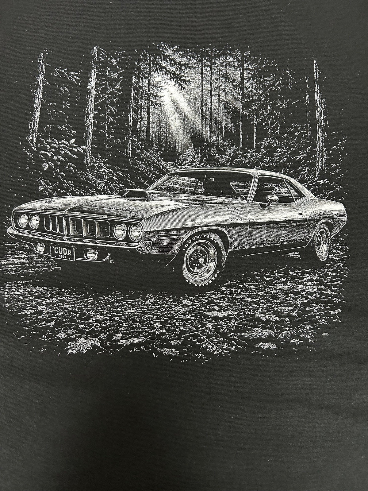 Close-up of the 1971 Plymouth Cuda print on a black t-shirt