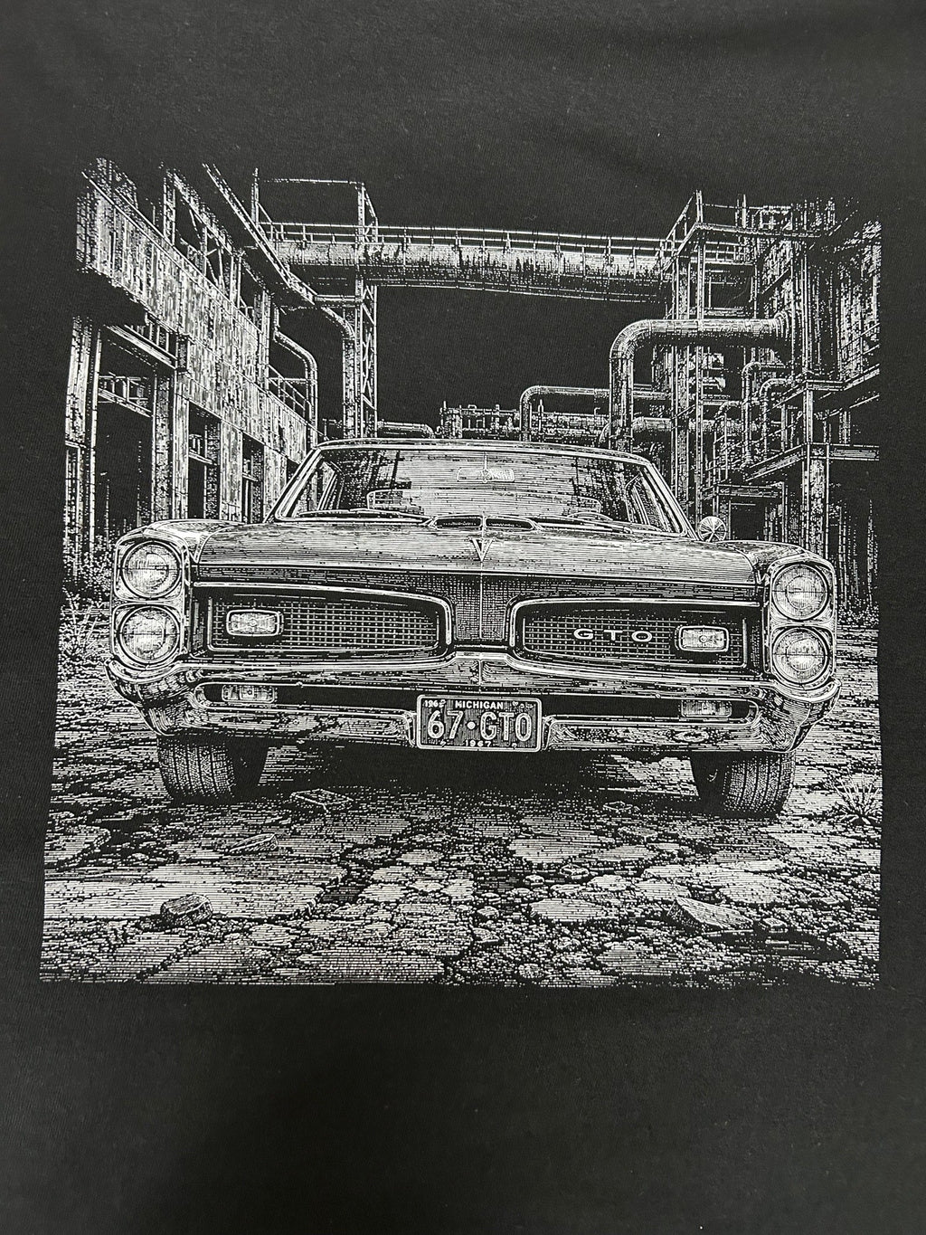 Close-up of the 1967 Pontiac GTO print on a black t-shirt