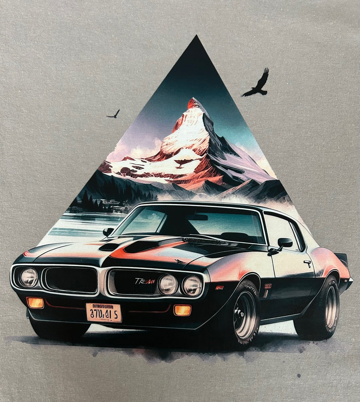 Close-up of the Pontiac Firebird mountain print on a gravel grey t-shirt