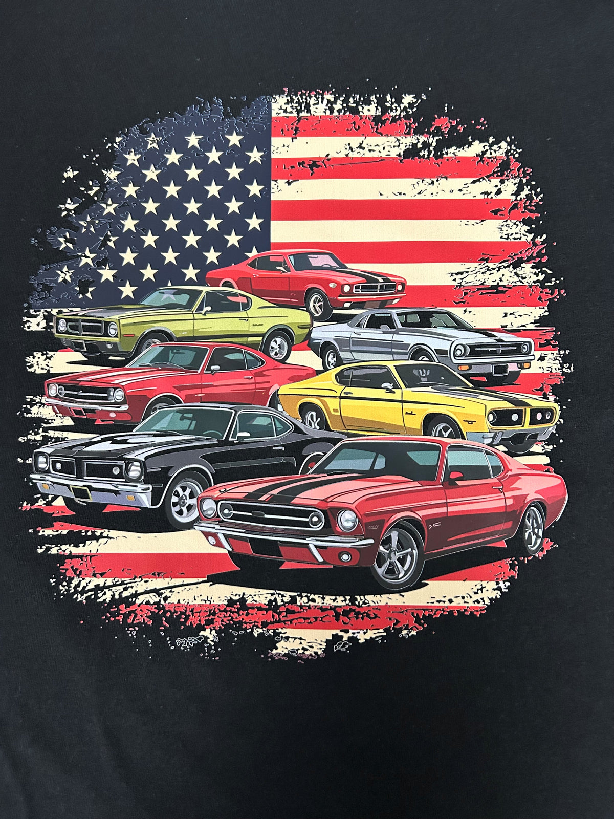 Close-up of the classic muscle car American flag collage print on a black t-shirt