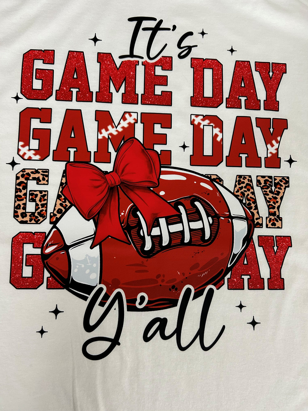 Close-up of the It's Game Day Y'all print on a white t-shirt