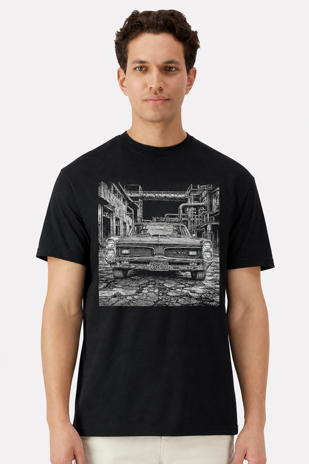 Model wearing a black t-shirt with a detailed 1967 Pontiac GTO factory print