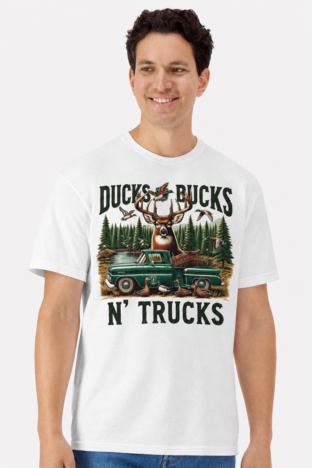 Model wearing a white t-shirt with a Ducks Bucks N' Trucks buck, ducks and vintage pickup print