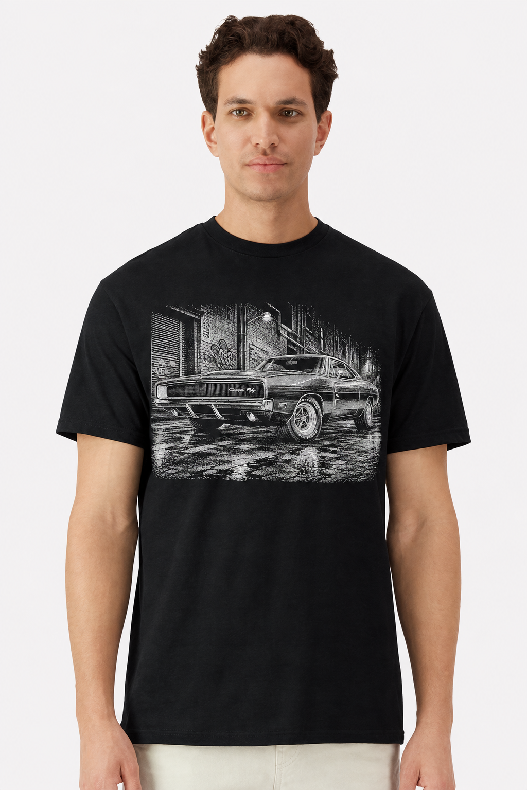 Model wearing a black t-shirt with a detailed 1970 Dodge Charger R/T alley print