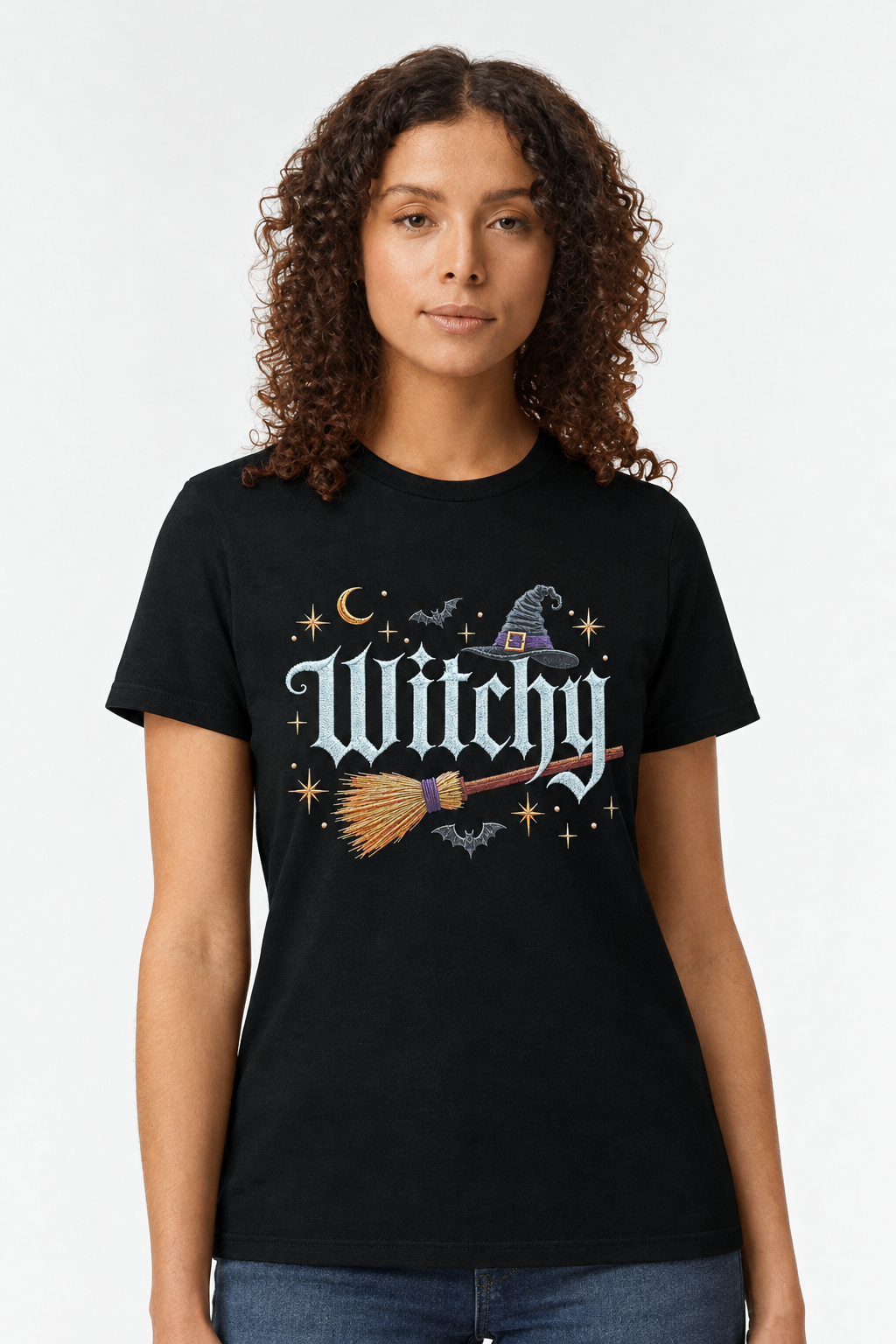 Woman wearing a black t-shirt with a gothic Witchy witch hat and broomstick print