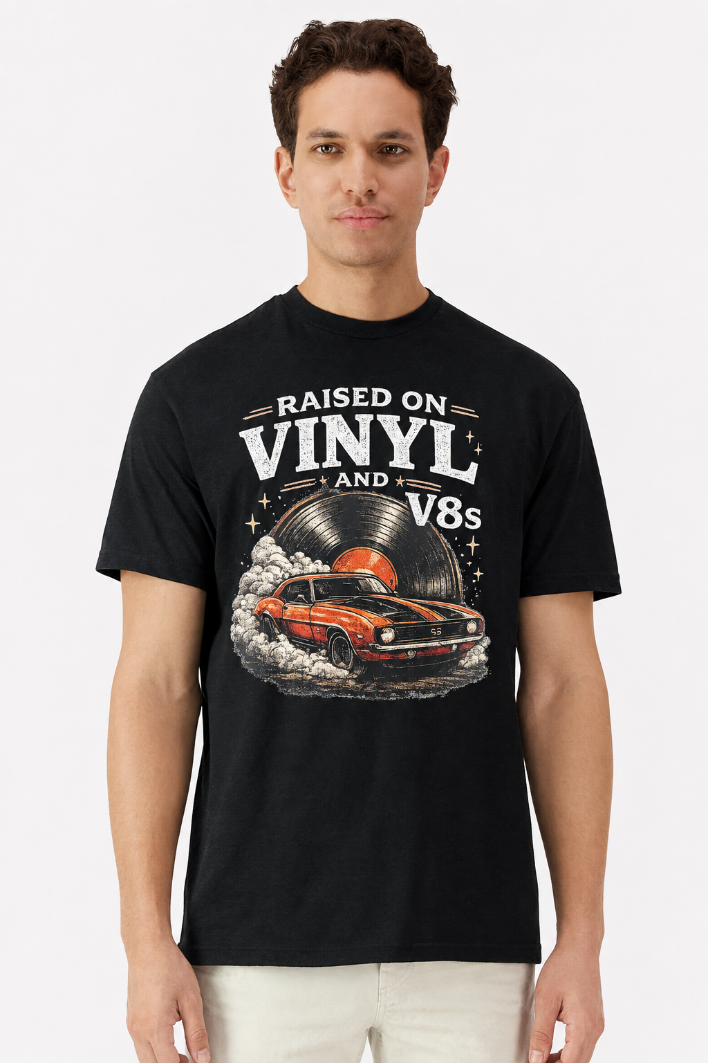 Model wearing a black t-shirt with a retro Raised On Vinyl and V8s Camaro burnout print