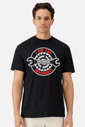 Model wearing a black t-shirt with an I Am The Warranty wrench and gear emblem print