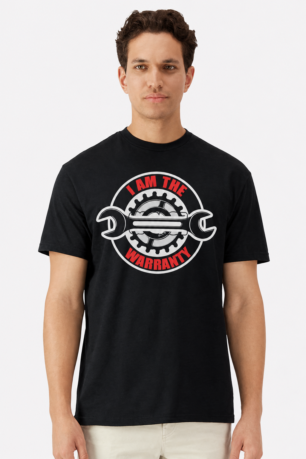 Model wearing a black t-shirt with an I Am The Warranty wrench and gear emblem print