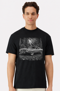 Model wearing a black t-shirt with a detailed 1971 Plymouth Cuda forest road print
